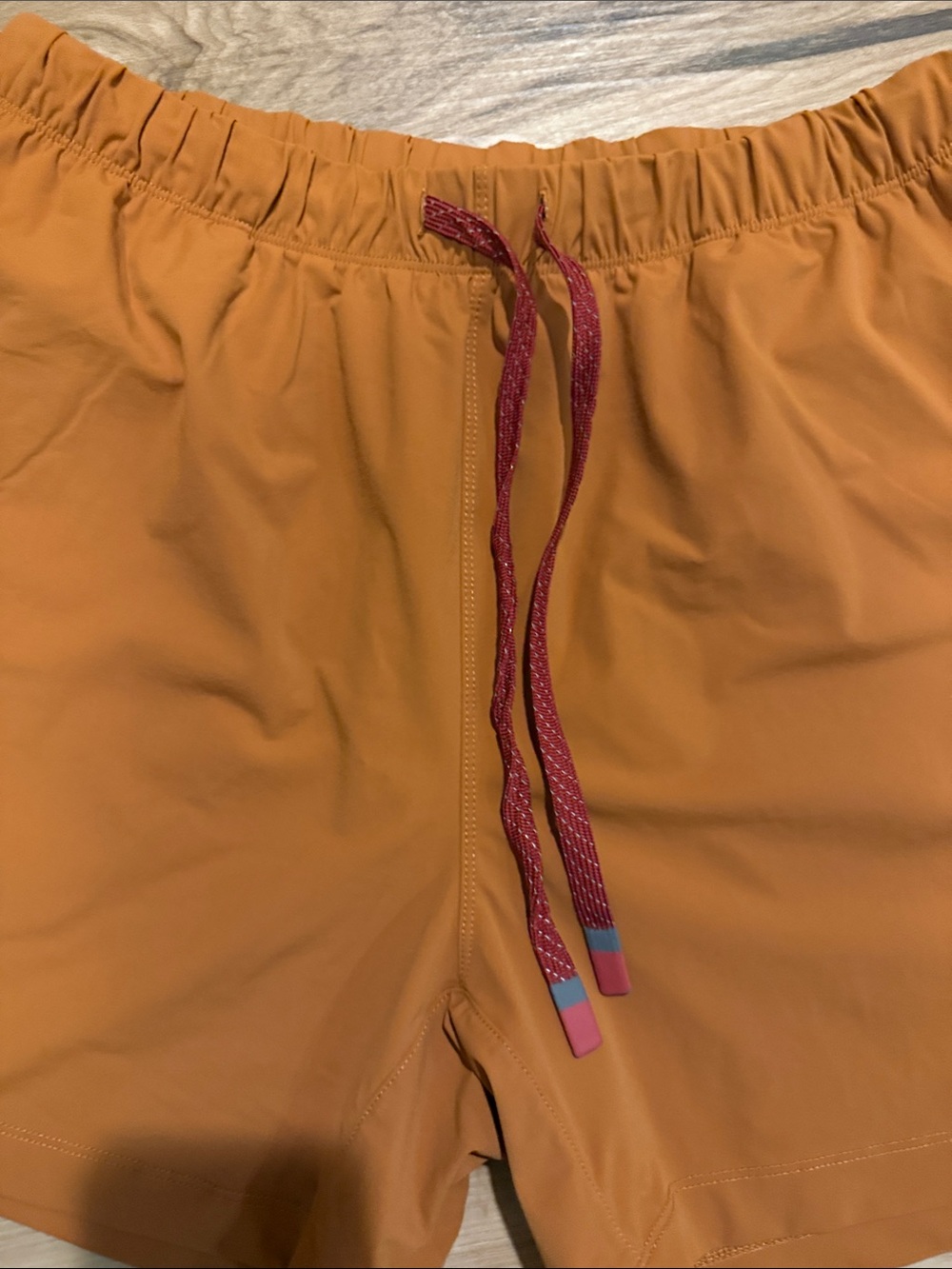 5 inch Fabletics Men's Orange Athletic Shorts with Red Drawstring - Picture 2 of 5